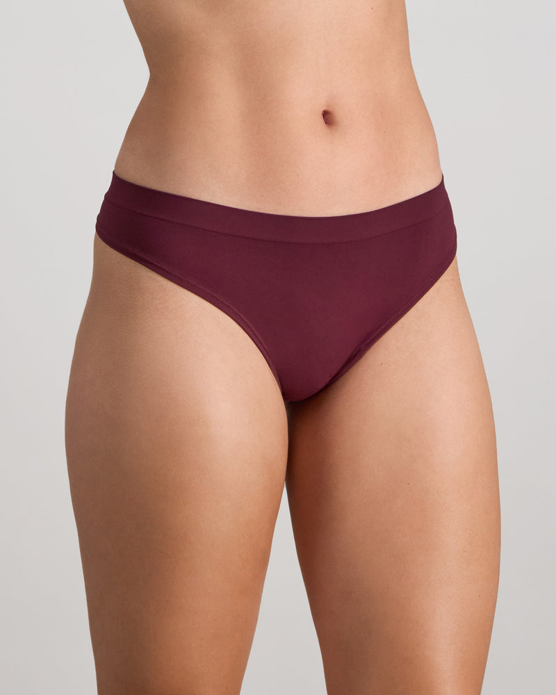 Model wears Seamless Soft Thong in FIG. On body side view