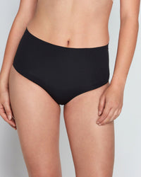 Model wears Bamboo Bodywear Full Brief in BLACK. On body front view
