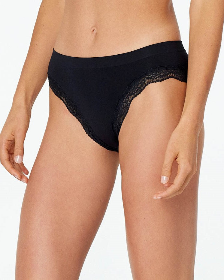 Model wears Nikki Bikini in BLACK. On body front view