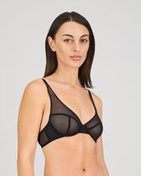 Model wears Sheer Impact Underwire Bra in BLACK. On body side view