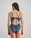 Model wears Margot Estelle Bodysuit in MEDITERRANEA. On body back view
