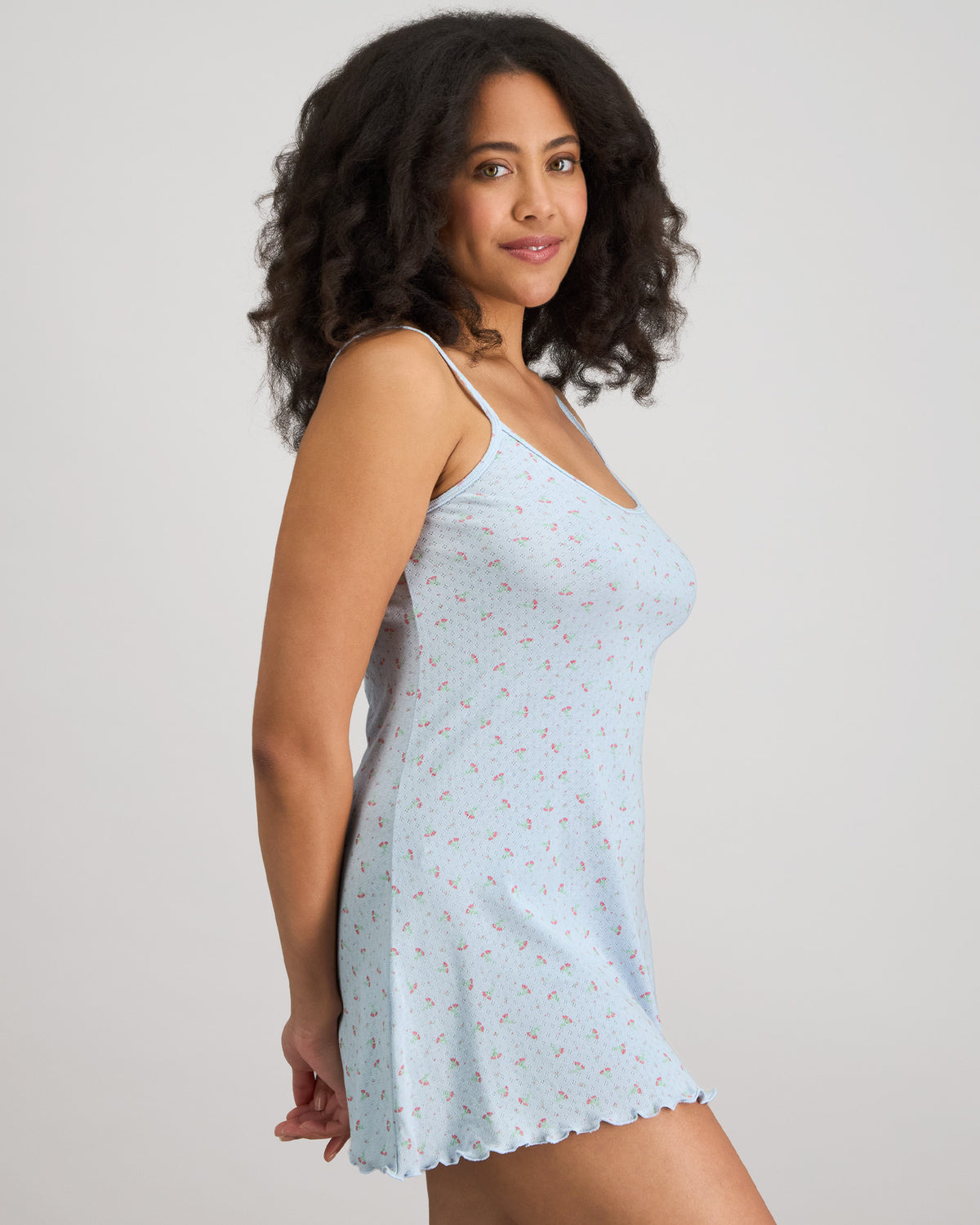 Model wears Smoothie Chemise in SKYWAY. On body side view