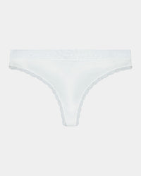 Model wears Cotton Logo Thong in WHITE. On body front view