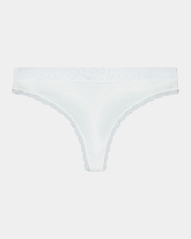 Model wears Cotton Logo Thong in WHITE. On body front view