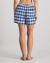 Model wears Cosy Flannel Short in BLUE CHECK. On body back view