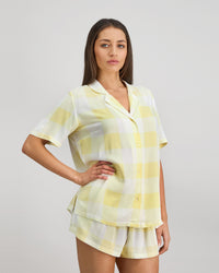 Model wears Dare To Dream Short PJ Set in LEMON MERINGUE. On body side view