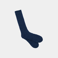 Model wears Cardrona Socks in INSIGNIA BLUE. On body side view
