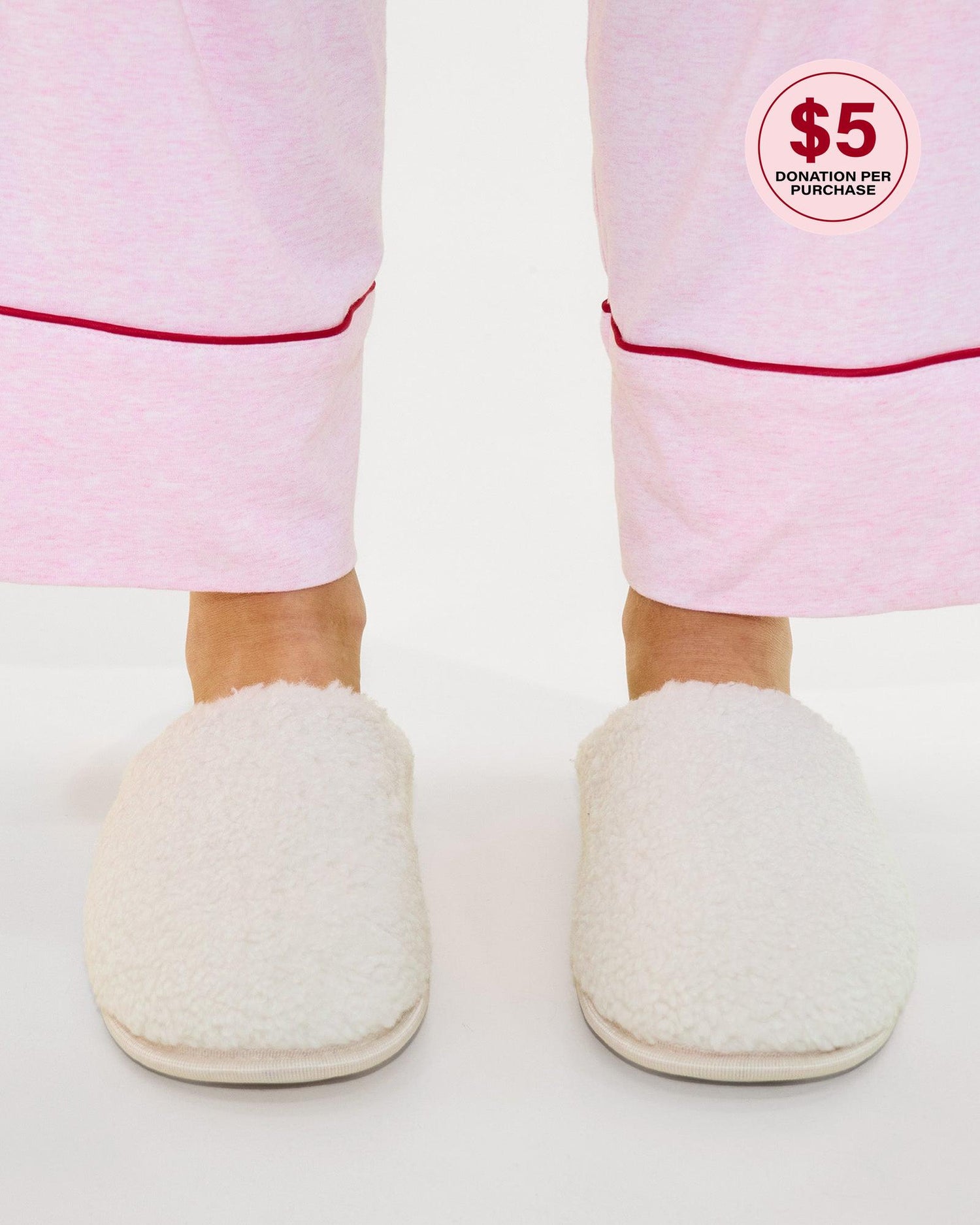 Model wears Teddy Slippers in CREAM. On body side view