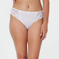 Model wears Body Lace High Cut Brief in WHITE. On body front view