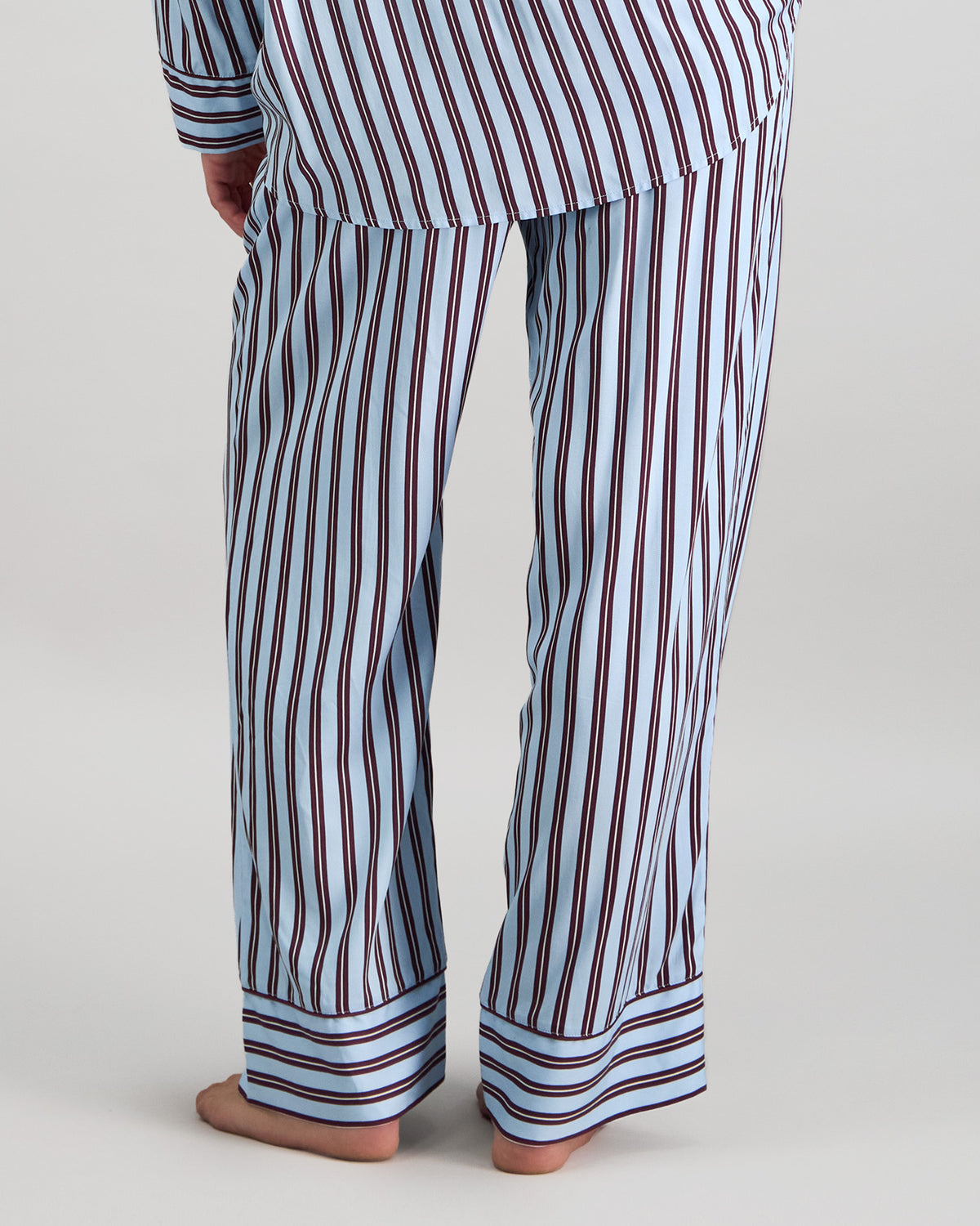 Model wears Cabana Stripe Long Pj Pant in COOL BLUE. On body back view