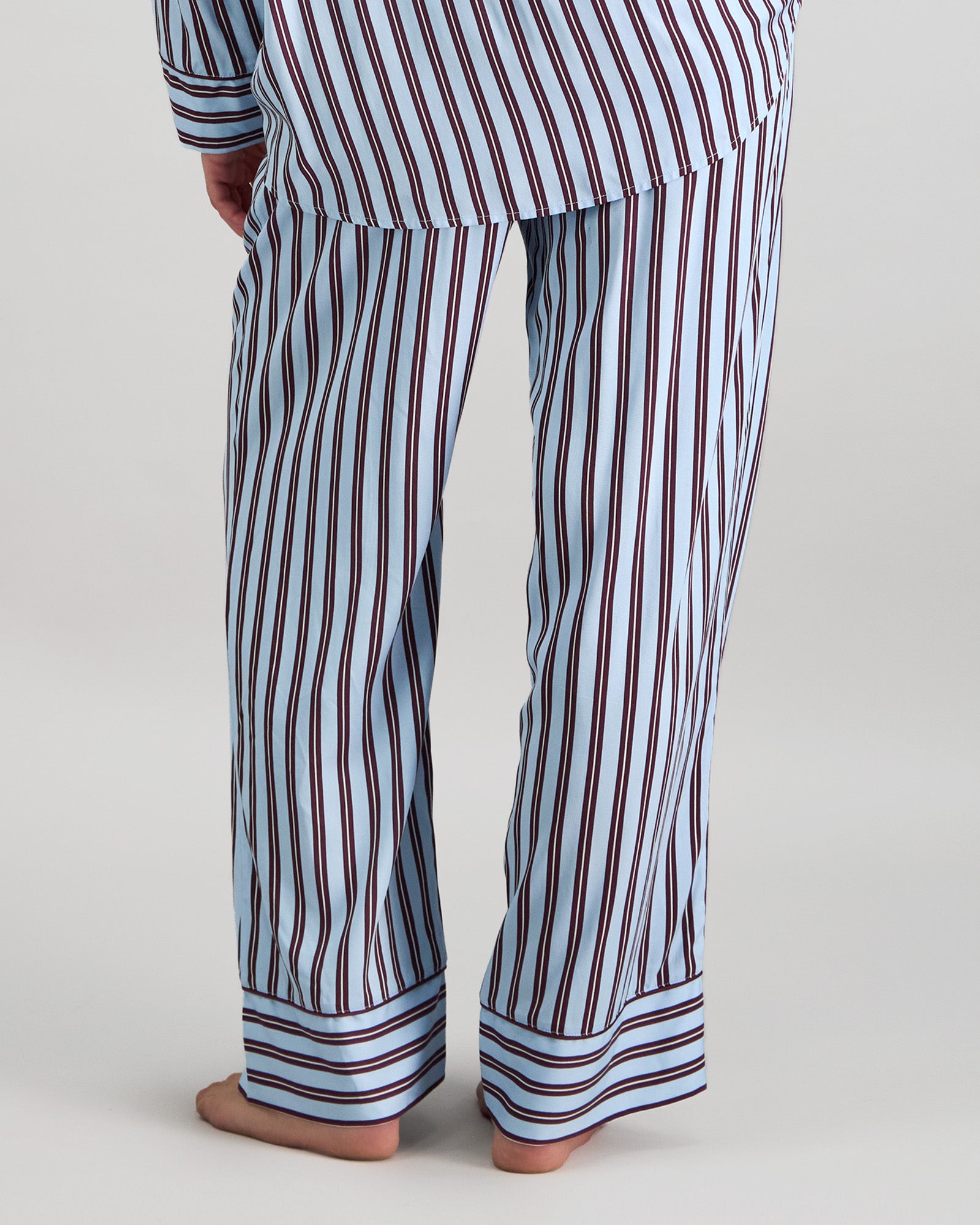 Model wears Cabana Stripe Long Pj Pant in COOL BLUE. On body back view