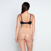 Model wears Medium Control Thong in CARAMEL. On body back view