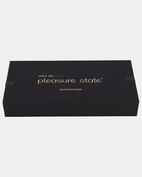 Model wears Silk Brilliance Eye Mask in INK. On body back view