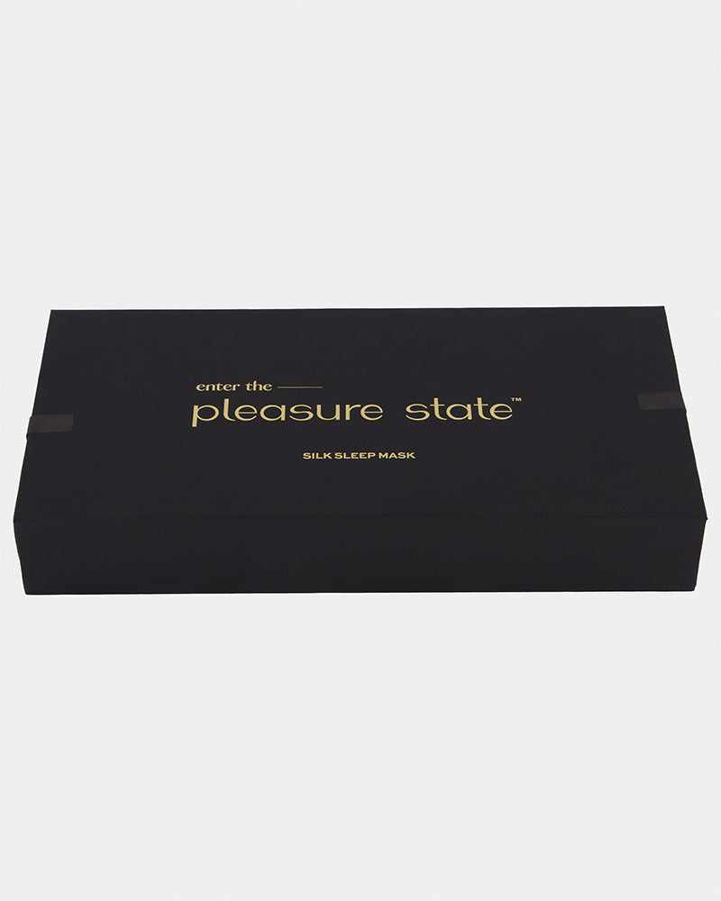 Model wears Silk Brilliance Eye Mask in INK. On body back view