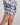 Model wears Cosy Flannel Short Pj in NAVY BLAZER. On body side view