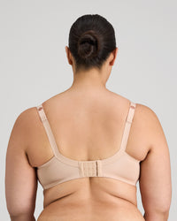 Model wears Graceful Lace Underwire Bra in LATTE. On body back view