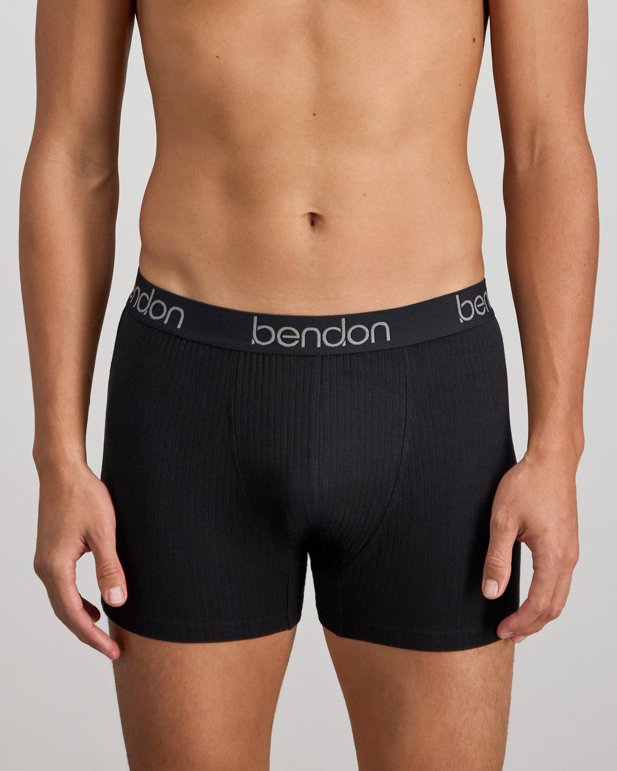 Model wears Cotton Texture Mens Trunk in BLACK. On body front view