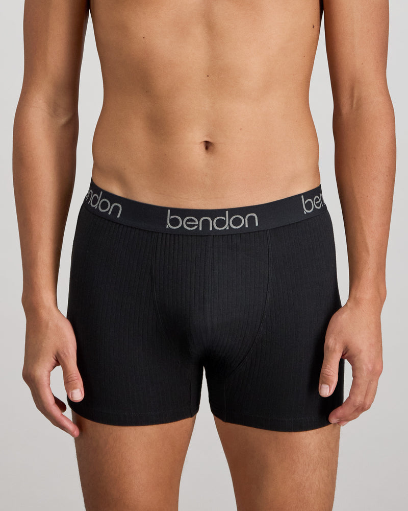 Model wears Cotton Texture Mens Trunk in BLACK. On body front view