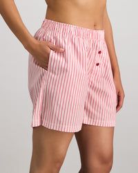 Model wears Cabana Stripe Boxer in CANDY CANE. On body side view