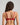 Model wears Niara Underwire Bra in JESTER RED. On body back view