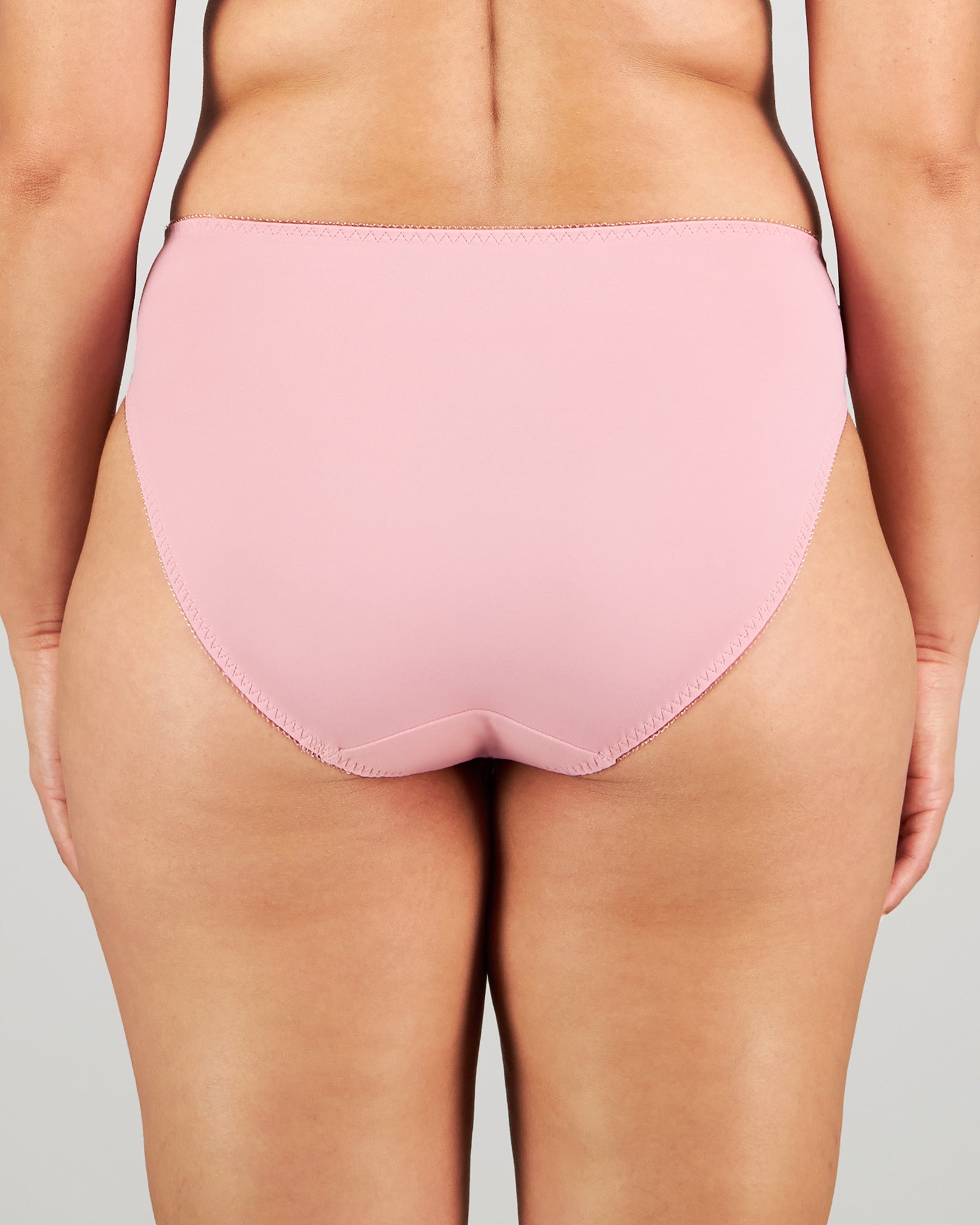 Model wears Coral High Cut Brief in LILAS. On body back view
