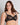 Model wears Daring Underwire Bra in BLACK. On body side view