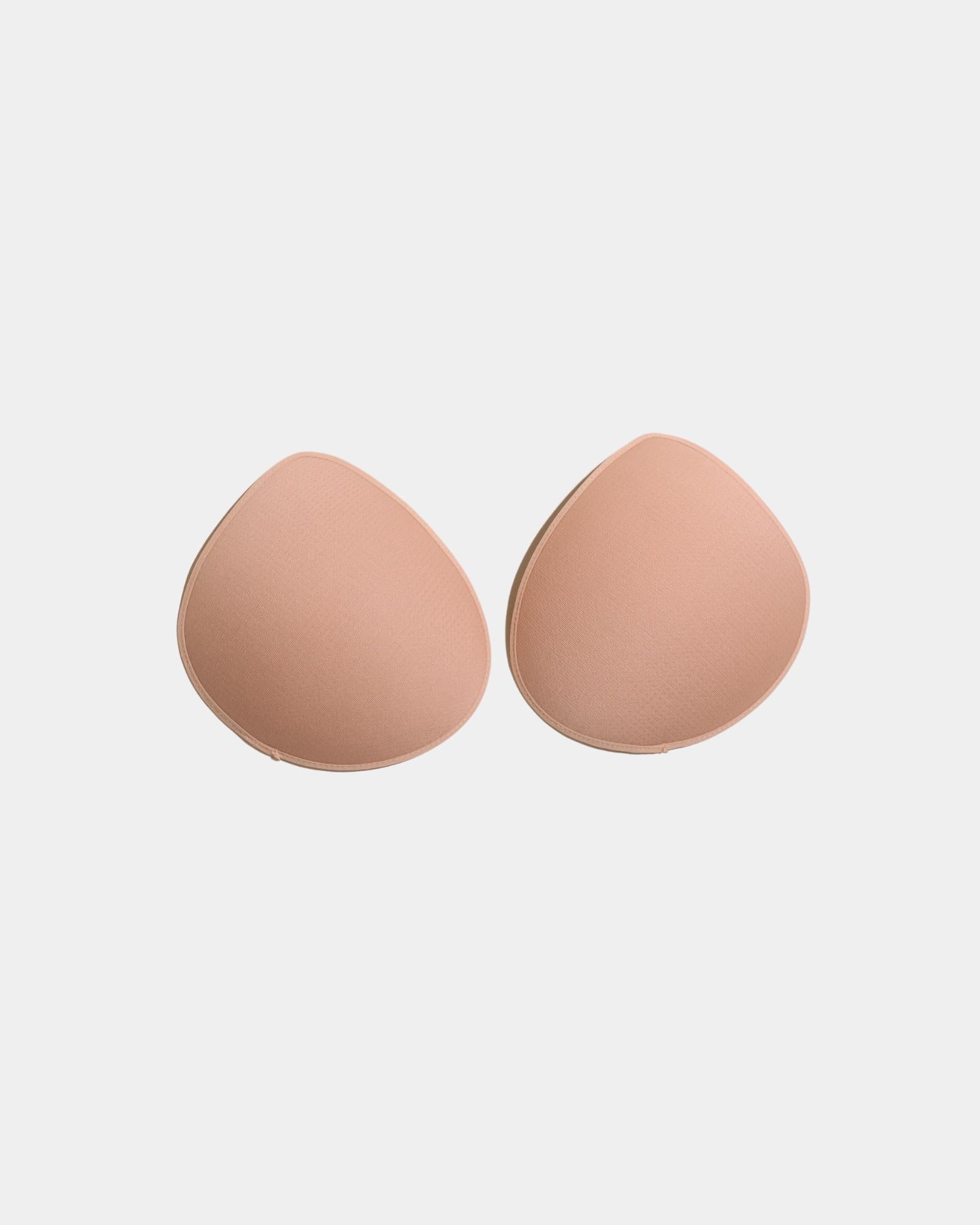 Model wears Reusable Nursing Pads in Nude. On body front view