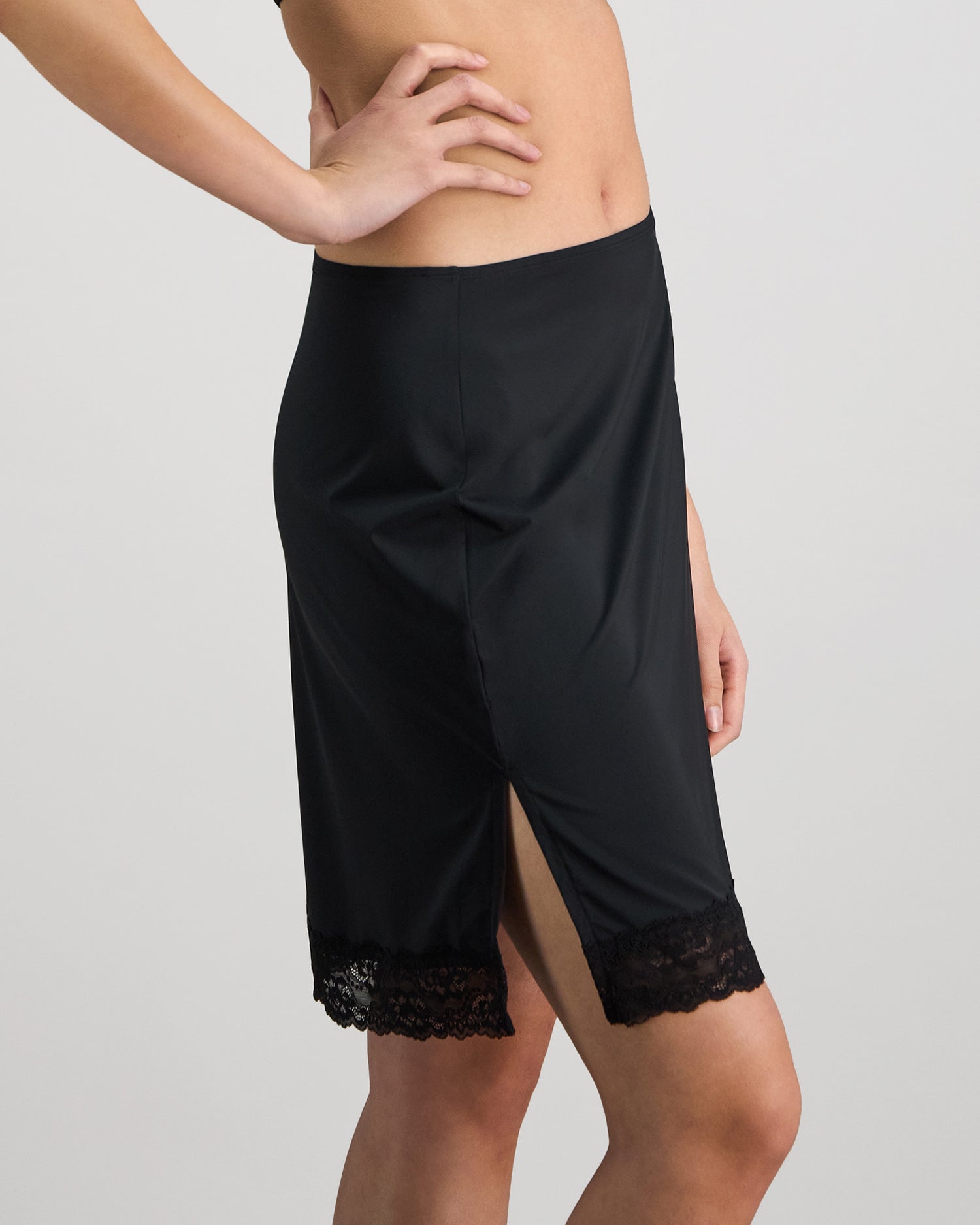 Model wears Understatement Slip in BLACK. On body side view
