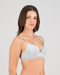 Model wears Simply Seamless Contour Bra in GREY MARL/WHITE STRIPE. On body side view