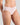 Model wears Au Naturel High Cut Brief in FESTIVAL BLOOM. On body side view
