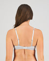 Model wears Simply Seamless Wire Free Bra in GREY MARL/WHITE STRIPE. On body back view
