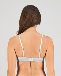 Model wears Simply Seamless Wire Free Bra in GREY MARL/WHITE STRIPE. On body back view
