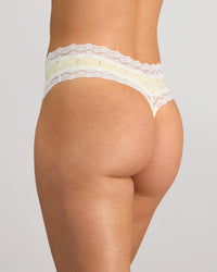 Daily Micro Thong in TRANSPARENT YELLOW. Flat lay back view