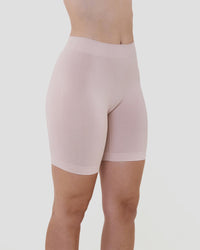 Model wears Smoothing Bodywear Chafer Short in CARAMEL. On body side view