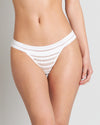 Model wears Morning Lola Thong in WHITE. On body front view