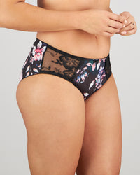 Model wears Wild Violet Full Brief in DARK FOLKLORE PRINT. On body side view
