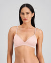 Model wears Simply Seamless Wire Free Bra in SILVER PINK. On body front view