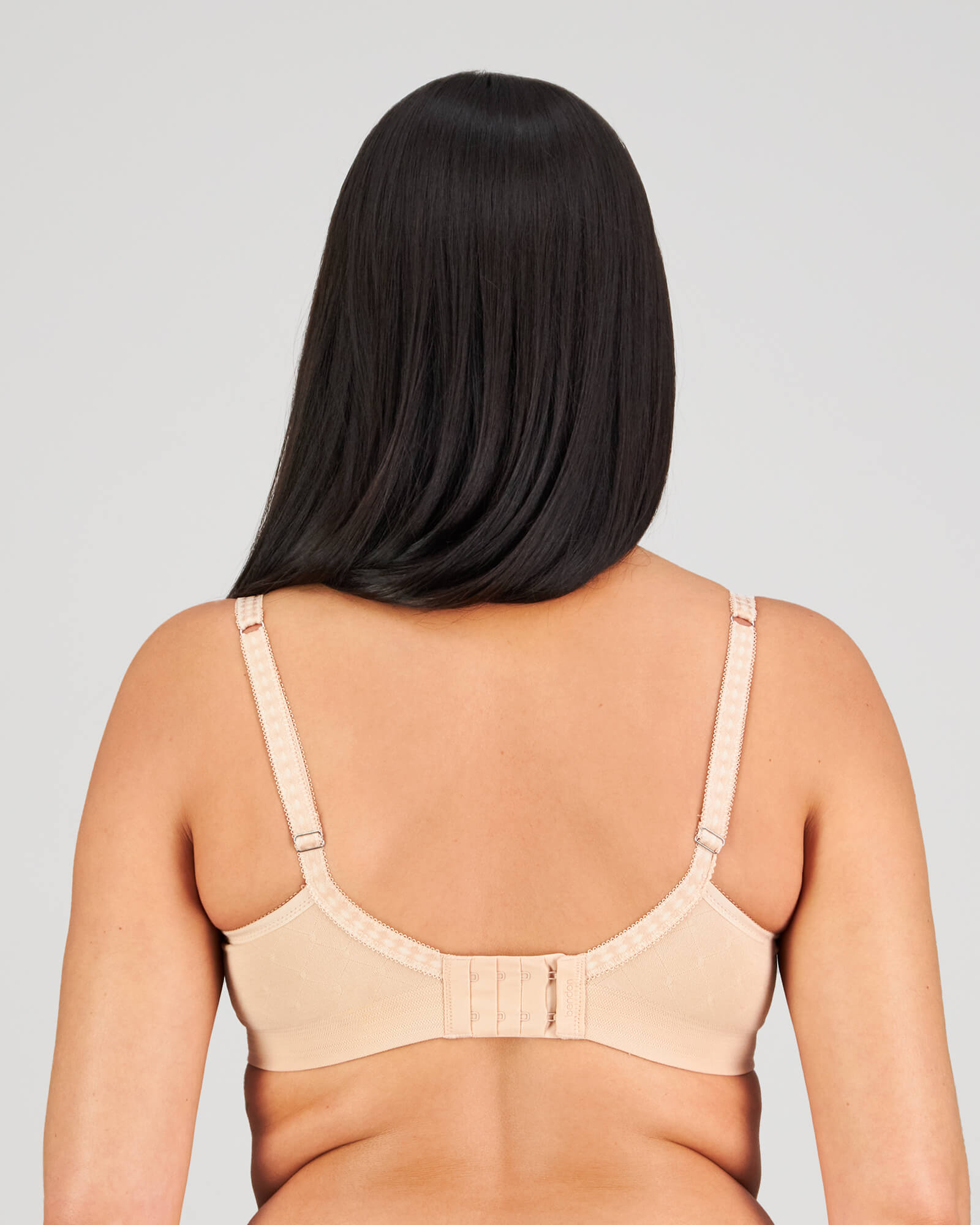 Model wears Bendon Body Contour Bra in LATTE. On body back view