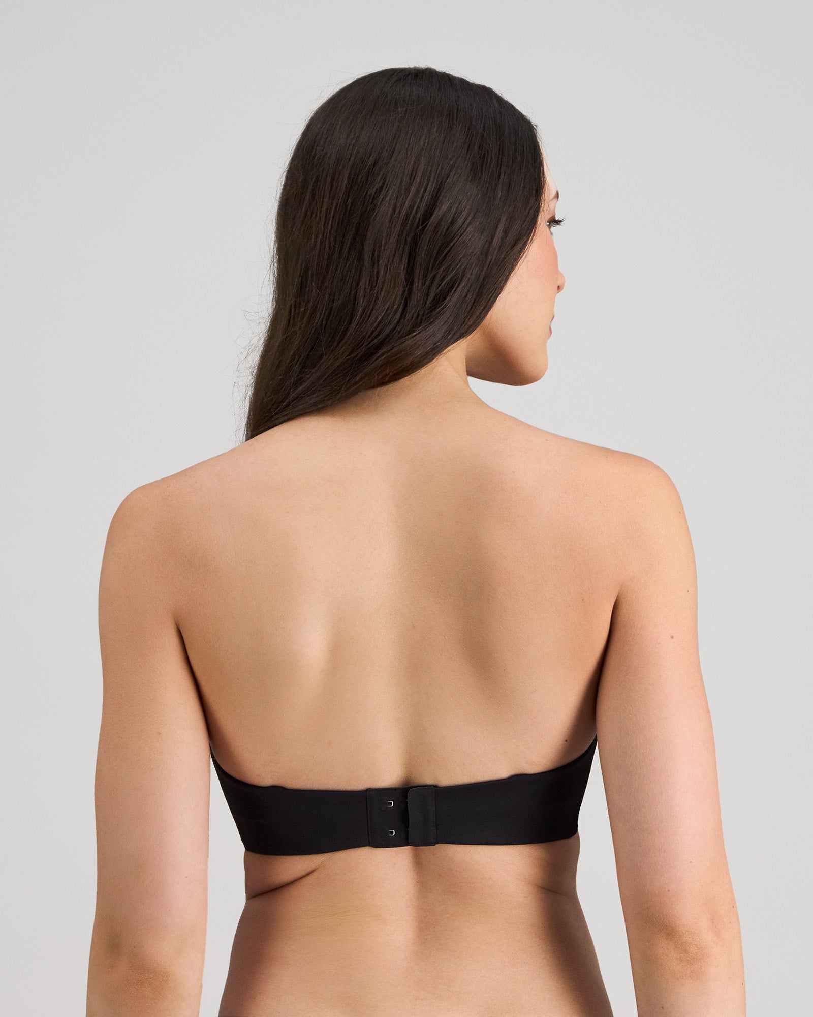 Model wears My Fit Smooth Strapless Bra in BLACK. On body back view