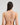 Model wears Golden Hour Underwire Bra in EVENING SAND. On body back view