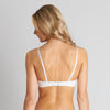 Model wears Nikki Wire Free Bra in WHITE. On body back view