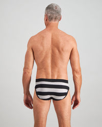 Model wears Rugby Stripe Mens Brief in BLACK RUGBY STRIPE. On body back view