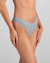 Model wears Au Naturel Thong in SLATE. On body front view
