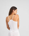 Model wears Simply Seamless Camisole in WHITE. On body back view