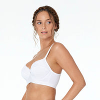 Model wears Castaspell Contour Long Line Bra in WHITE. On body side view