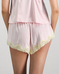 Model wears Dreamer Short in PALE LILAC. On body back view