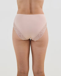 Model wears Cotton And Lace Full Brief in LATTE. On body back view