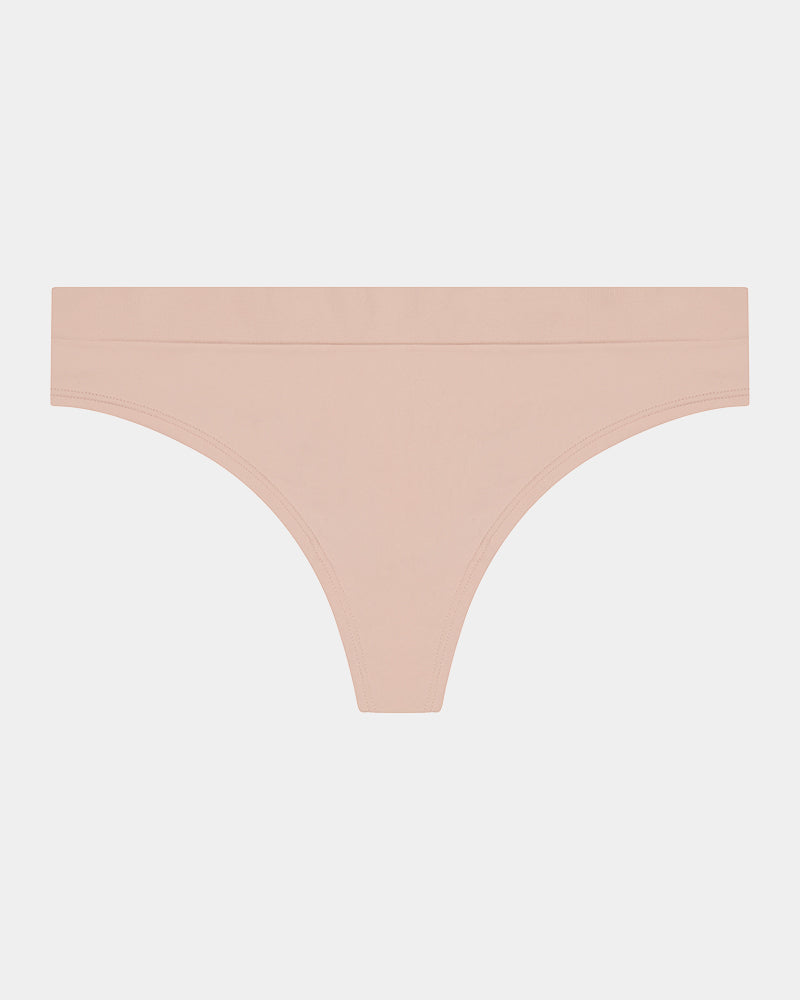 Seamless Soft Thong in LATTE. Flat lay front view