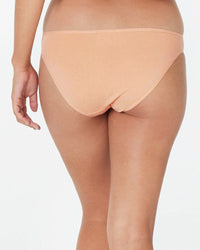 Model wears Clemence Bikini in LATTE. On body back view