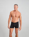 Model wears Cotton Stretch Mens Trunk in BLACK. On body front view